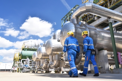  two workers in an oil refinery