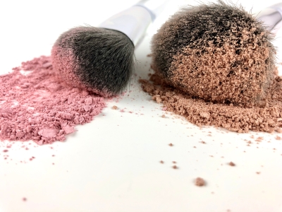 Powdered makeup and brushes.